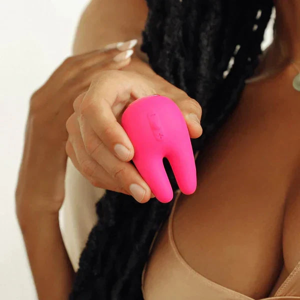 Woman and her partner holding vibrator.