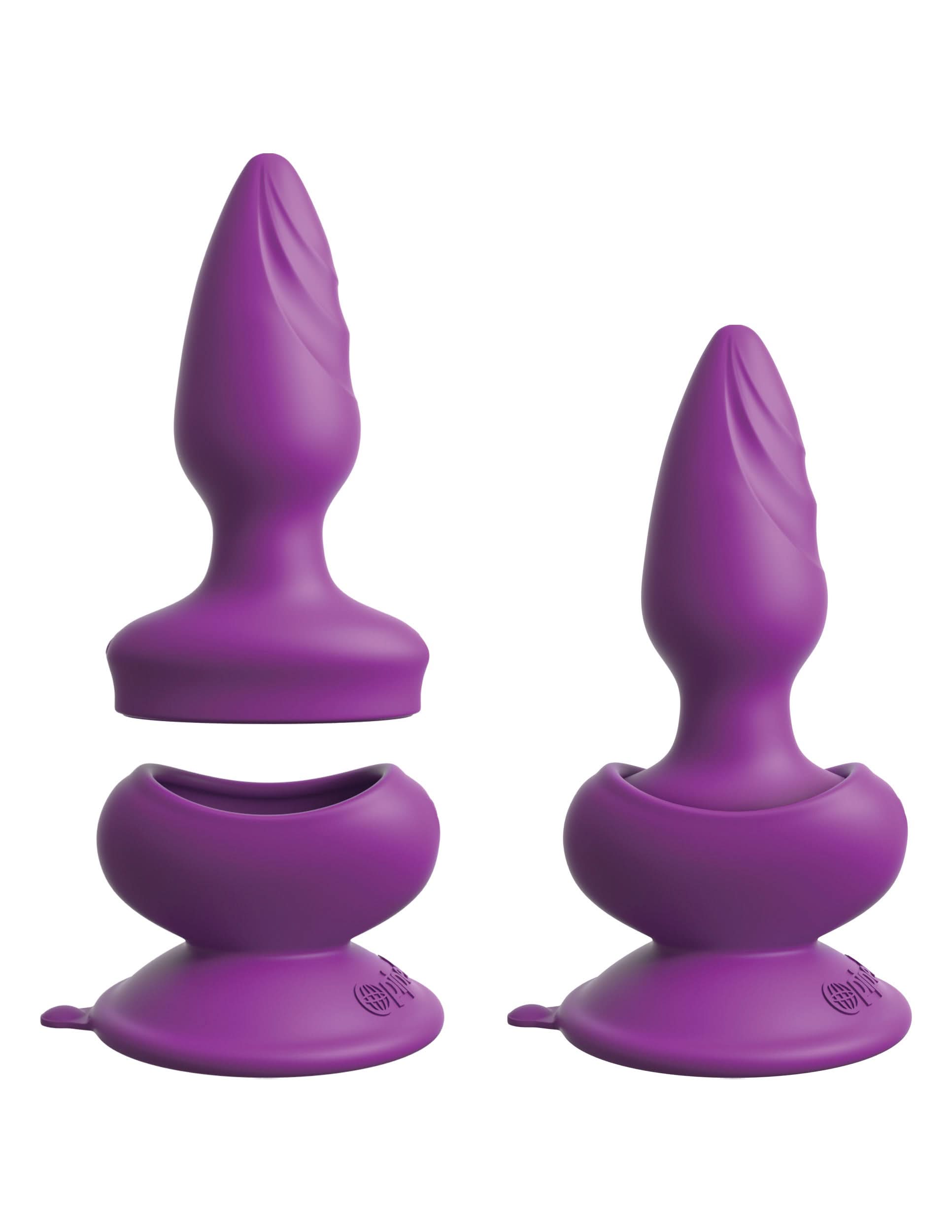 Two Pipedream® Wall Banger Plugs by 3Some in purple silicone, featuring suction cup bases, shown separated and assembled on a white background.