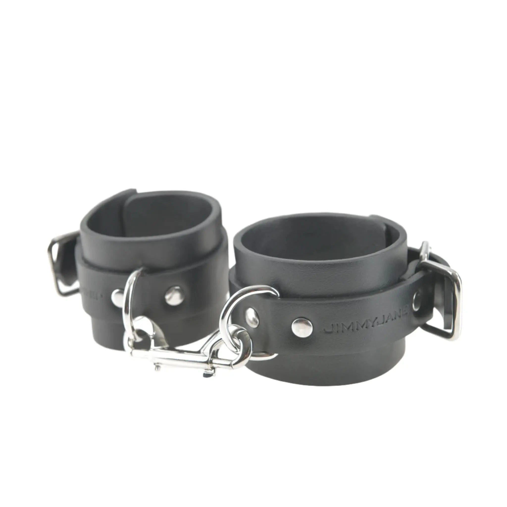 Luxury black leather wrist restraints with metal buckles by JIMMYJANE on white background