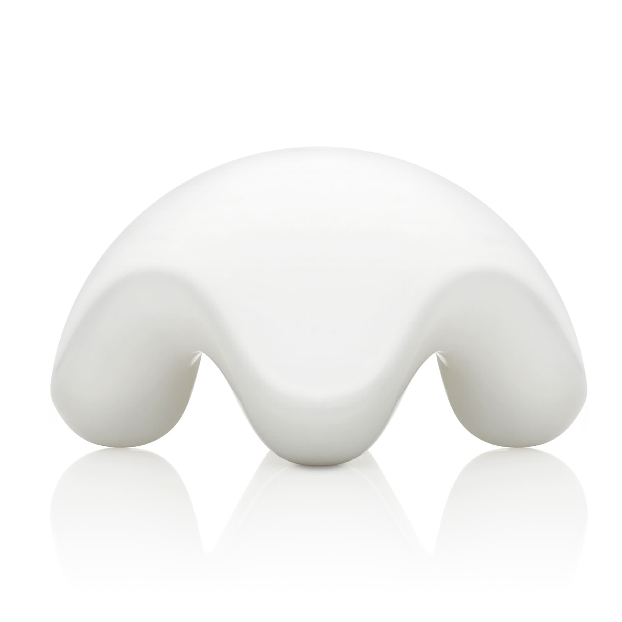 The JIMMYJANE® Contour White Ceramic Massage Stone features a smooth, curved, ergonomic design with three downward arches, resembling a modern minimalist sculpture.