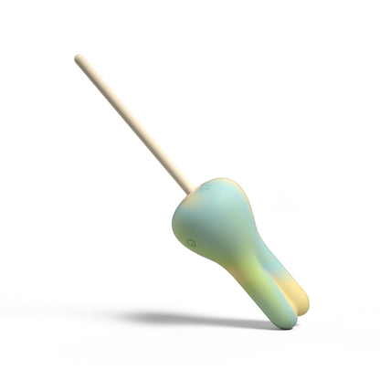 Colorful toy with a wooden stick on a white background
