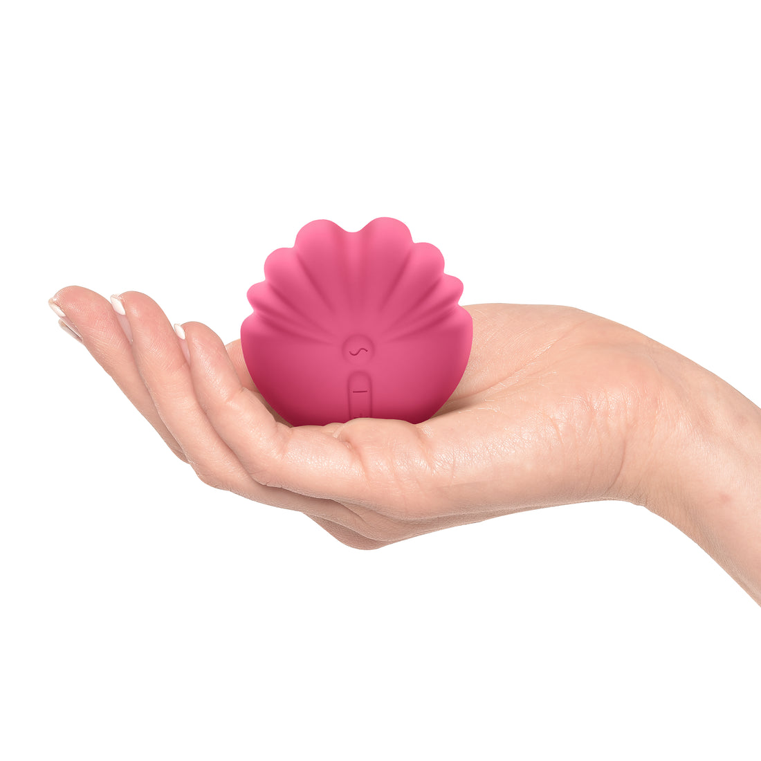 Front-facing shell shape clitoral vibrator pink in the palm of a white woman's hand