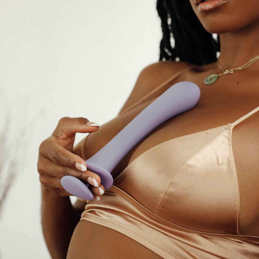 Woman holding the the soft silicone dildo Cyra