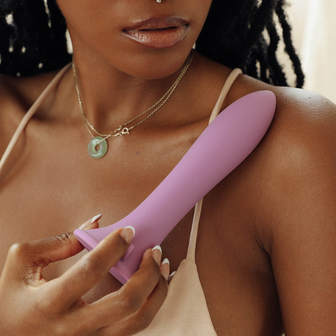 Model holding the purple silicone suction cup dildo - Canta