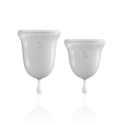 Two purple JIMMYJANE® Intimate Care Menstrual Cups of different sizes, made from FDA-cleared silicone with an ergonomic design, are shown upright on a plain white background.