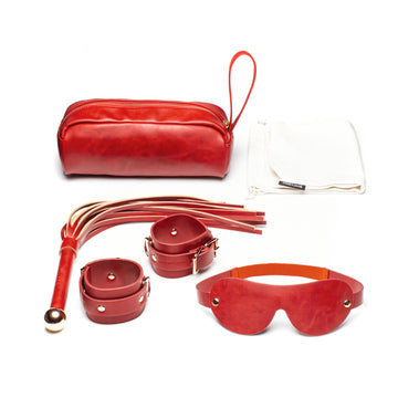 Front-facing set of vegan leather bondage accessories red