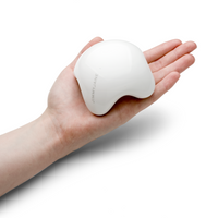 Four pronged contoured massage stone in hand white