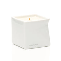 Red Tobacco scented Afterglow massage oil candle sitting on table